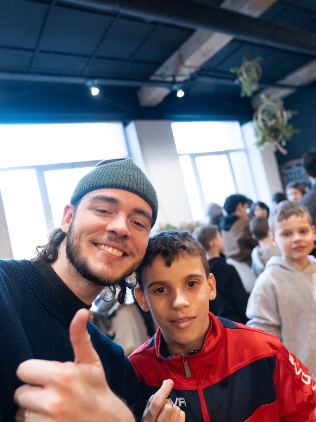 A YWAM staff member with a young friend during outreach
